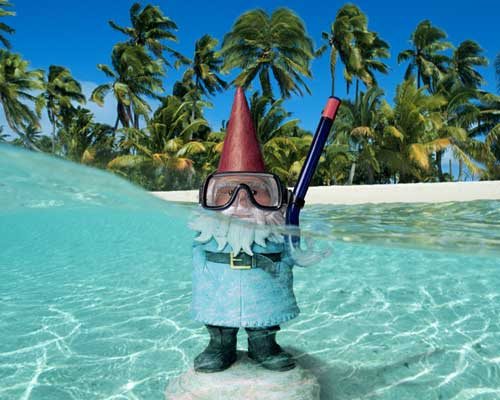 lawn gnome with a snorkel on a beach